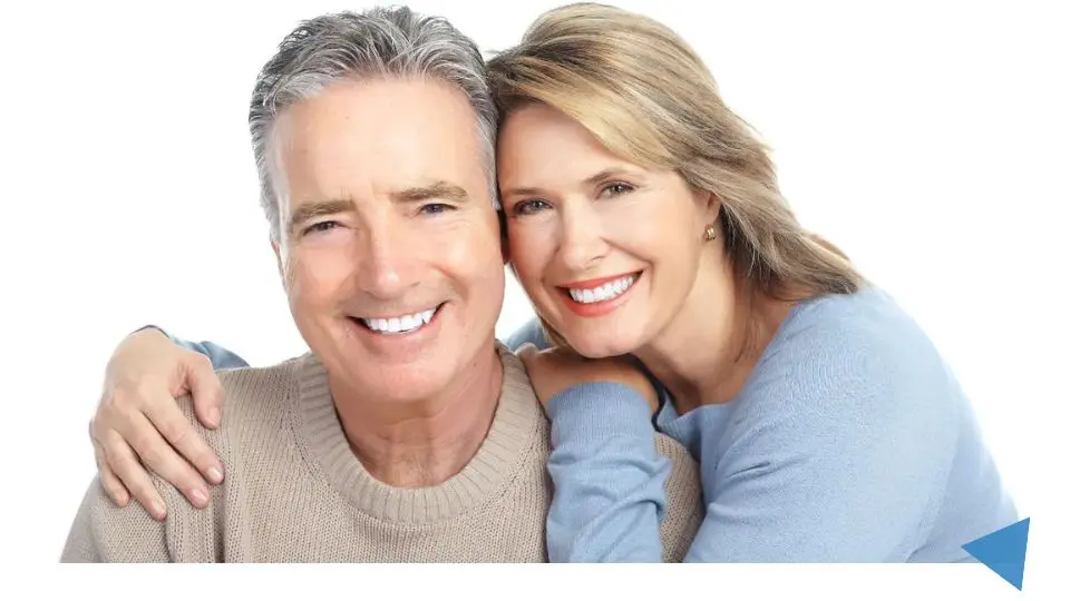 Couple Smiling After Dental Implant Treatment